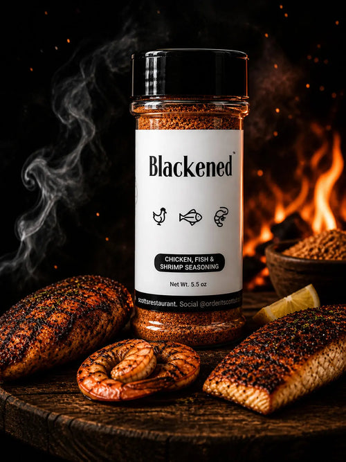 Blackened seasoning bottle with smoked chicken, fish, shrimp, and lemon slices against a fiery background.