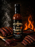 Scott's Smoked BBQ Sauce bottle with grilled ribs, sauce in bowl, and flame backdrop.