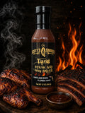 Scott's Smoked Tangy Steak and BBQ Sauce bottle with grilled steak, flames in background, 12 oz package.